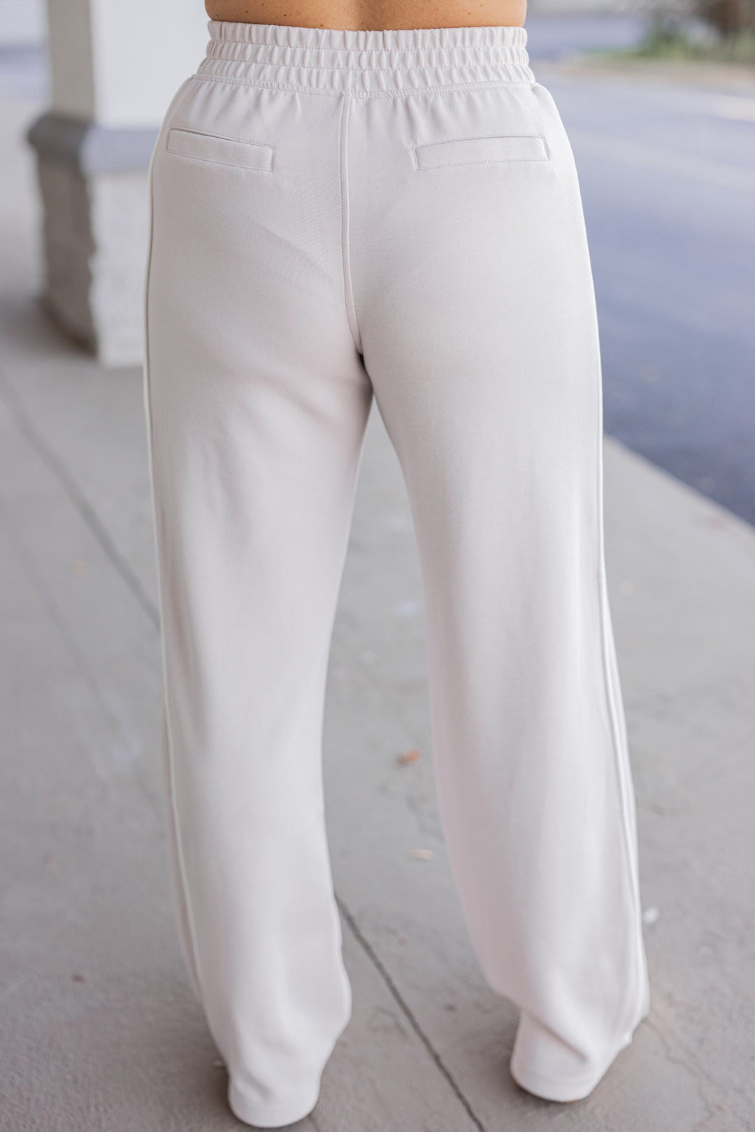 Women's mocha cream scuba knit straight leg pants by Rae Mode showing up close back view