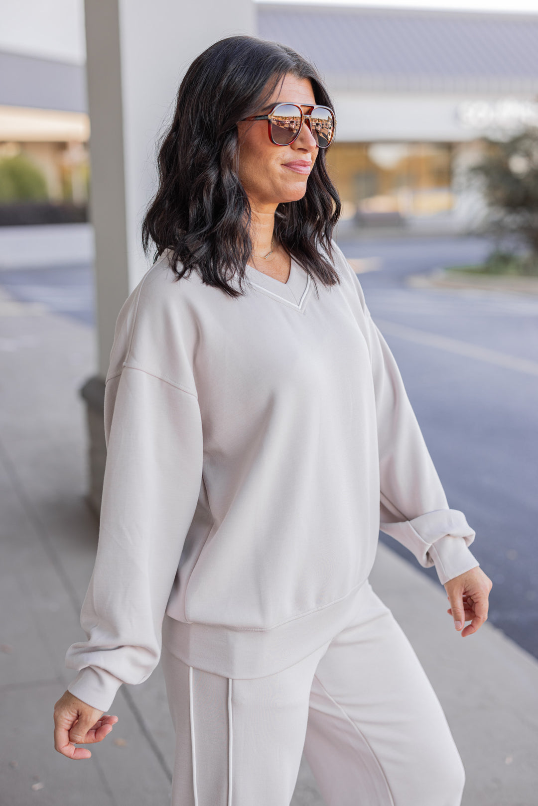 Women's mocha and cream scuba knit top by Rae Mode showing up close side view