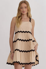 Entro Tan tiered sleeveless dress with black scalloped piping trim