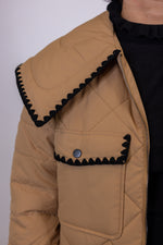 tan black ric rac trim quilted jacket