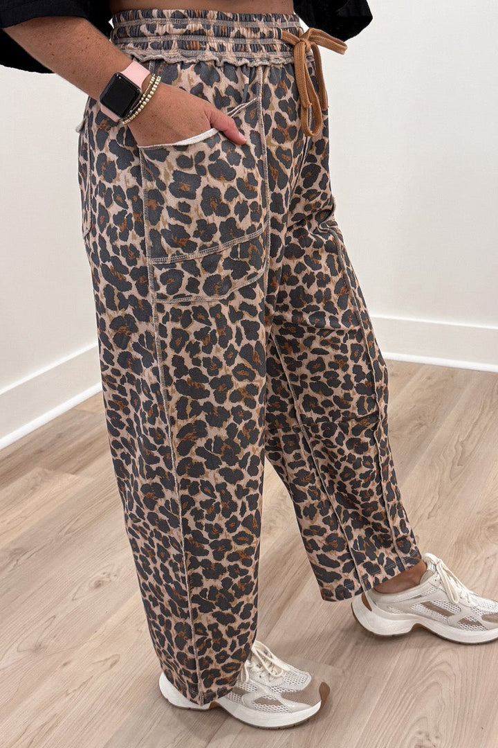 taupe black and brown leopard print french terry knit barrel leg pants with layered front pockets