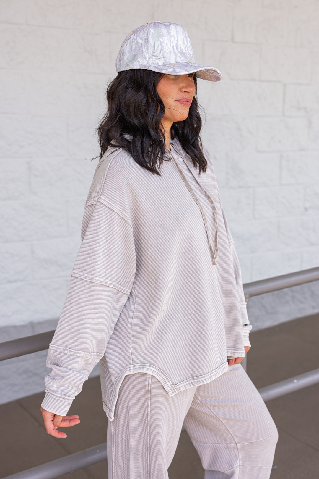 Women's mineral washed heather grey ribbed knit hooded pullover by Easel showing side view