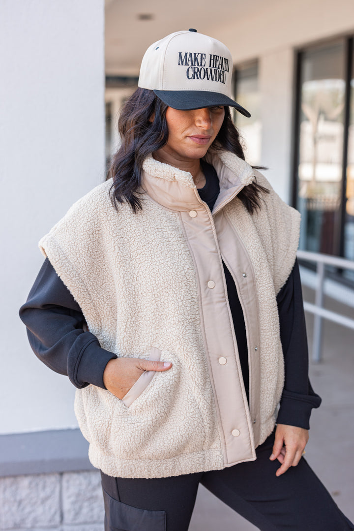 Women's taupe sherpa vest by Rae Mode showing slight side view