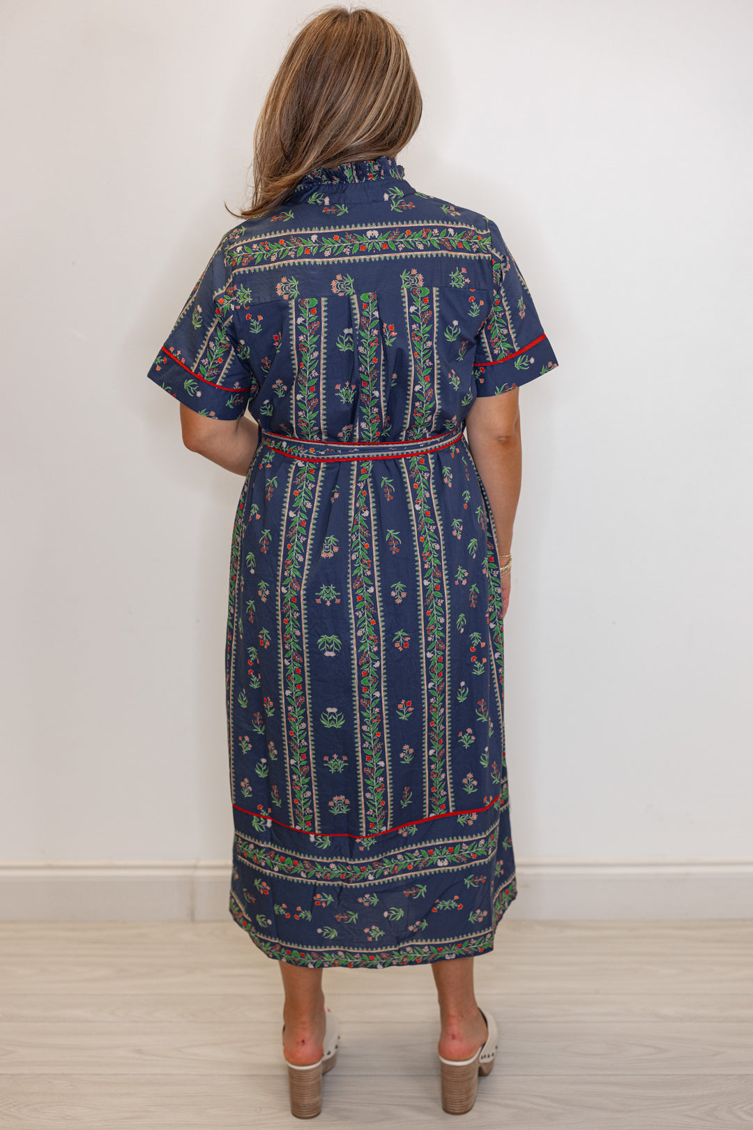 Women's navy blue button front midi dress with floral trellis print and red trim by Entro showing full back view