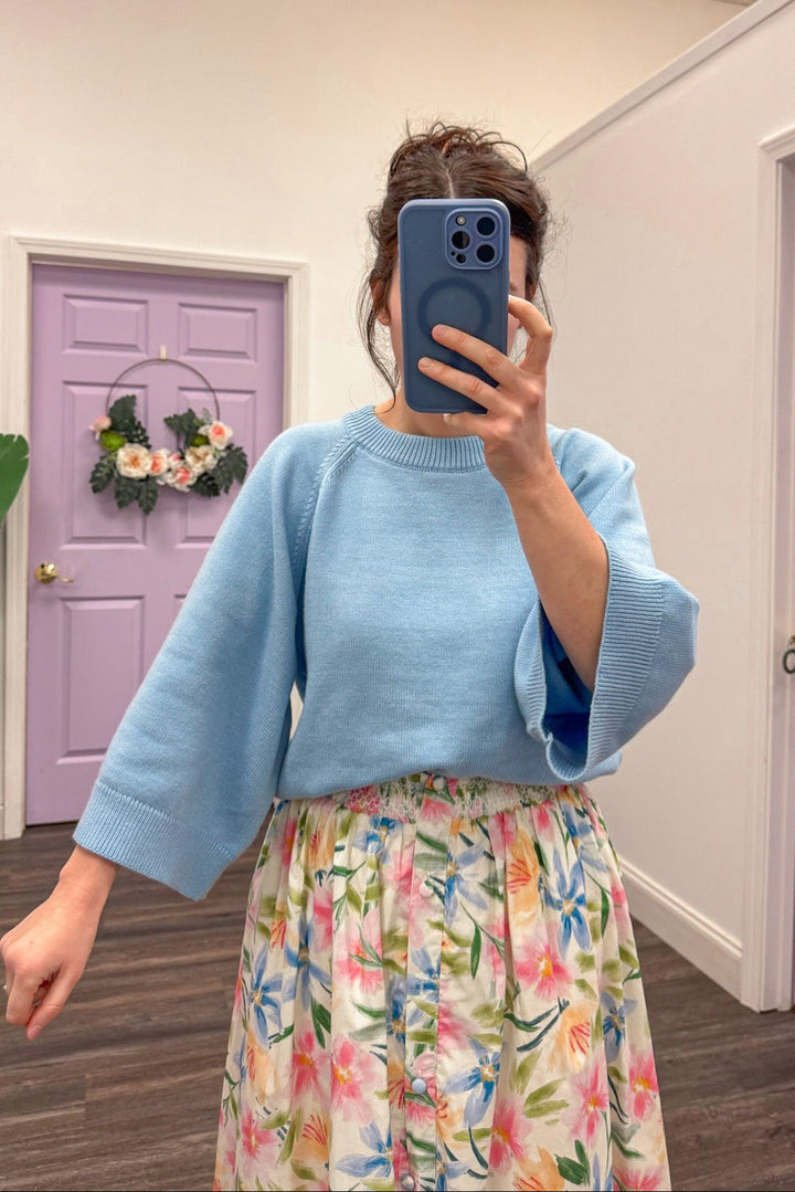 Women's light blue sweater with accent stitching details by Entro