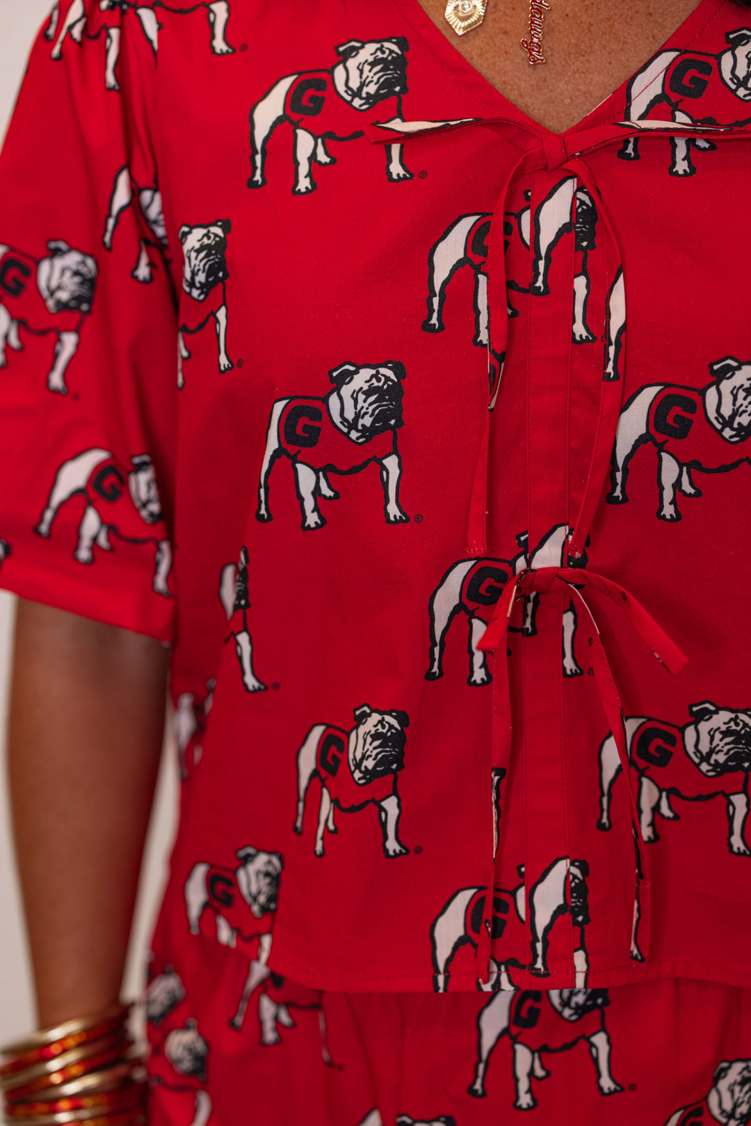 Women's red Bulldogs poplin top by Stewart Simmons showing bow ties on front bodice