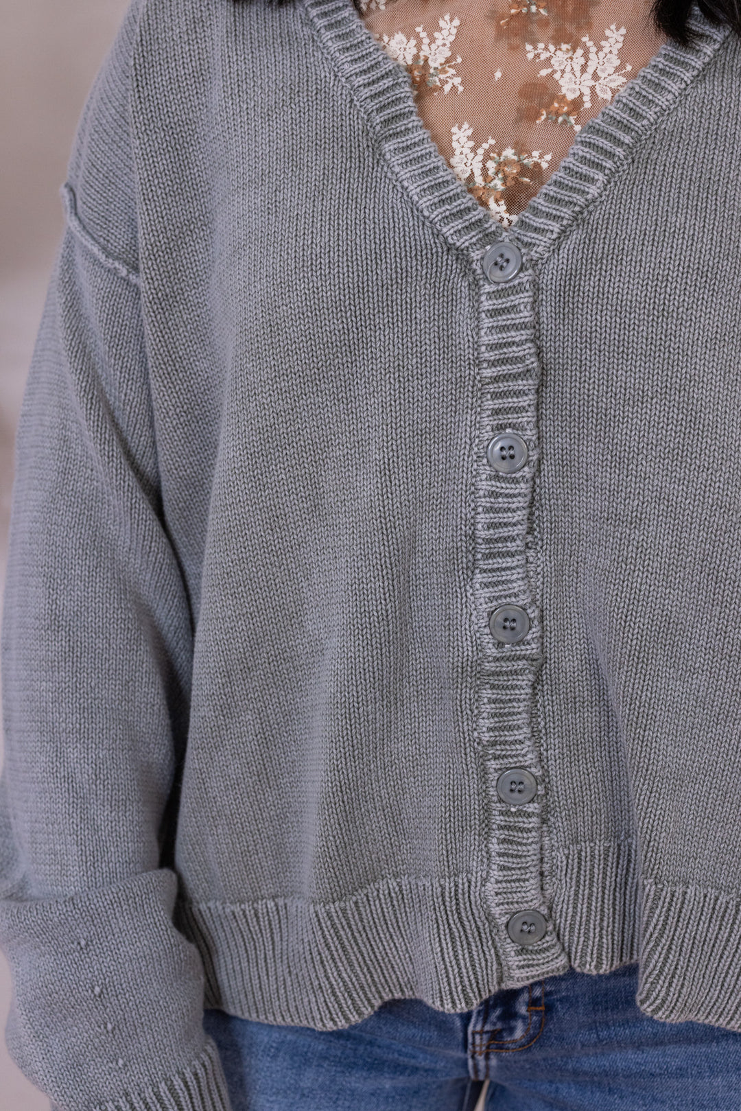 Women's washed olive green button front sweater knit cardigan showing up close front view