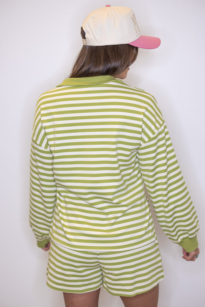 Women's ribbed knit top in matcha green and cream stripes by Entro showing up close back view