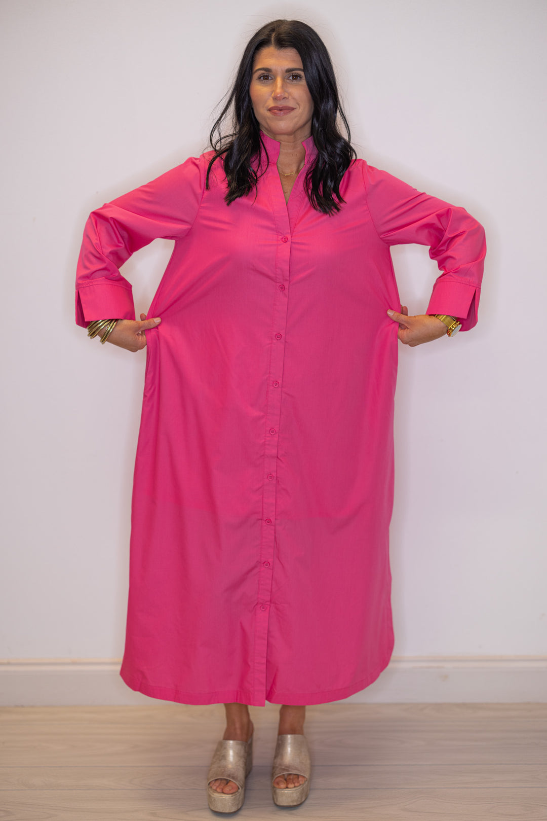 Women's pink button front midi dress by Entro showing relaxed silhouette  