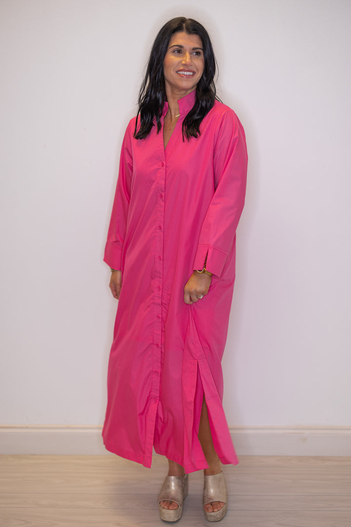 Women's pink button front midi dress by Entro showing flowy skirt