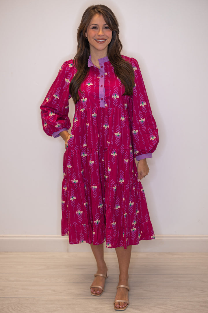 Women's magenta pink floral print tiered midi dress with button front bodice by Jodifl showing side pockets