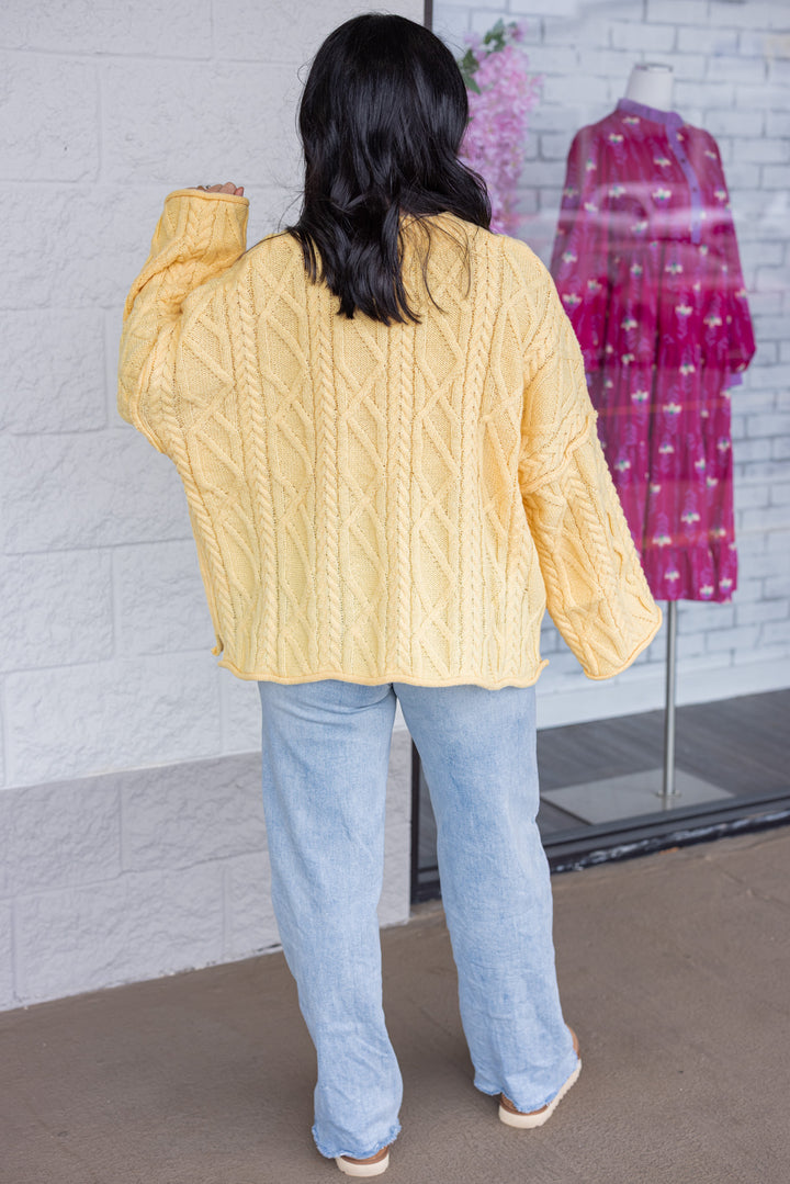 Women's yellow cable knit relaxed, boxy fit sweater by GeeGee showing full back view