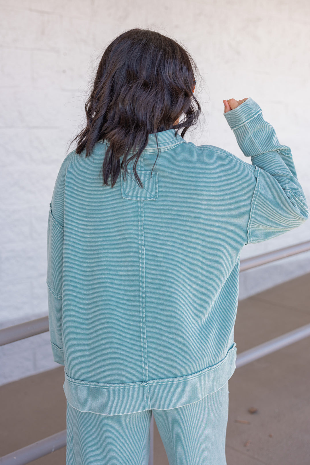 Women's washed teal ribbed knit top by Easel showing back view