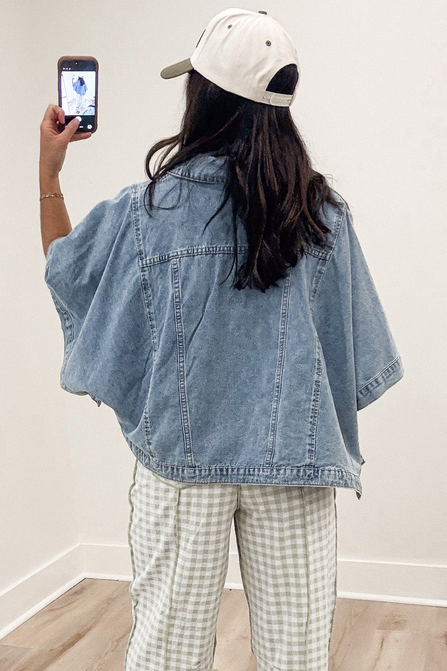 solid washed blue lightweight denim button front short drape sleeve poncho style jacket