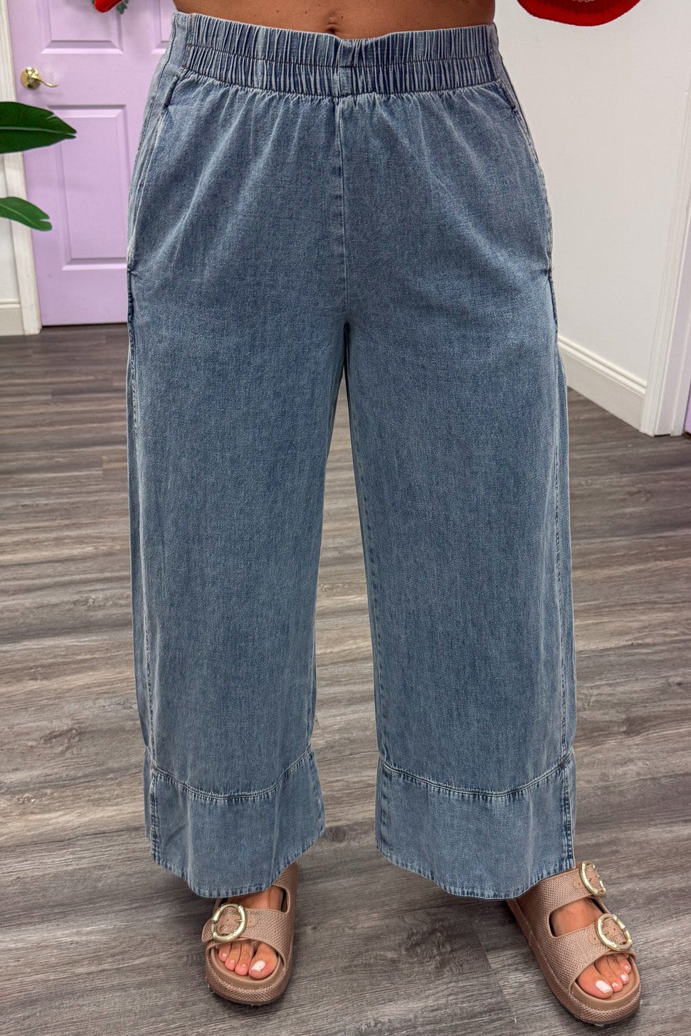 light washed blue denim elastic waistband wide leg pants with hem cuff detail
