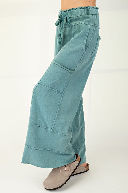 Women's terry knit wide leg pants in mineral washed teal green by Easel showing side view