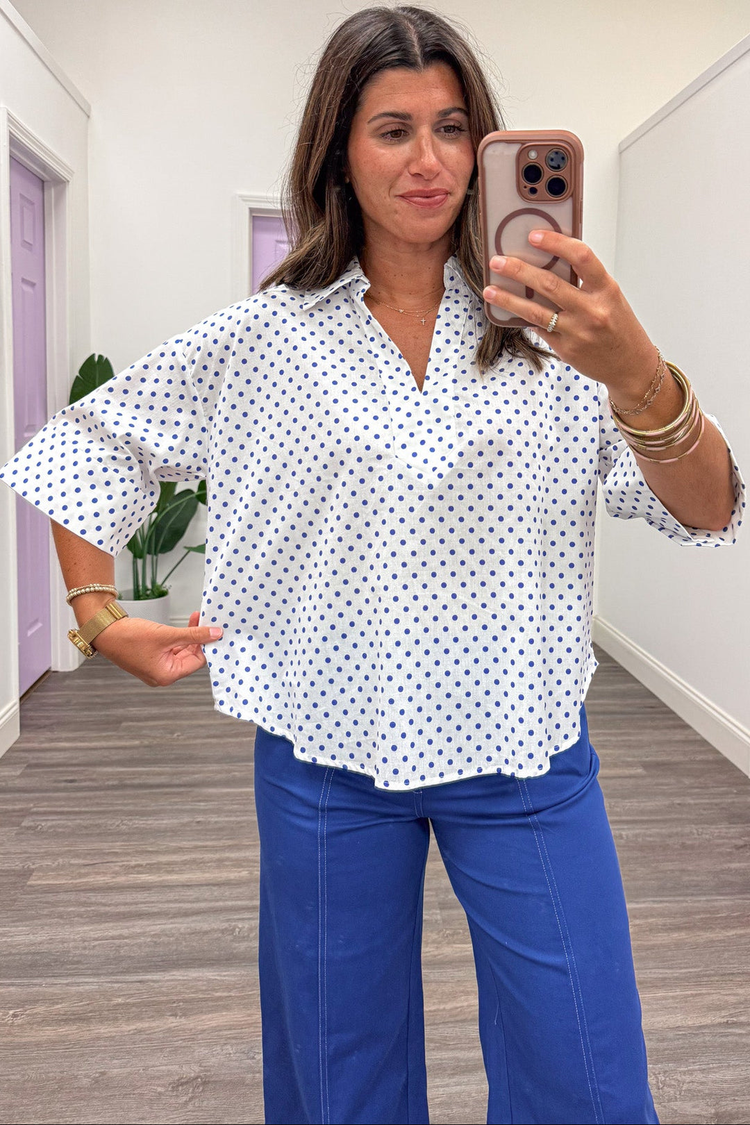 off white with small blue polka dot print collared v neckline relaxed silhouette cotton top