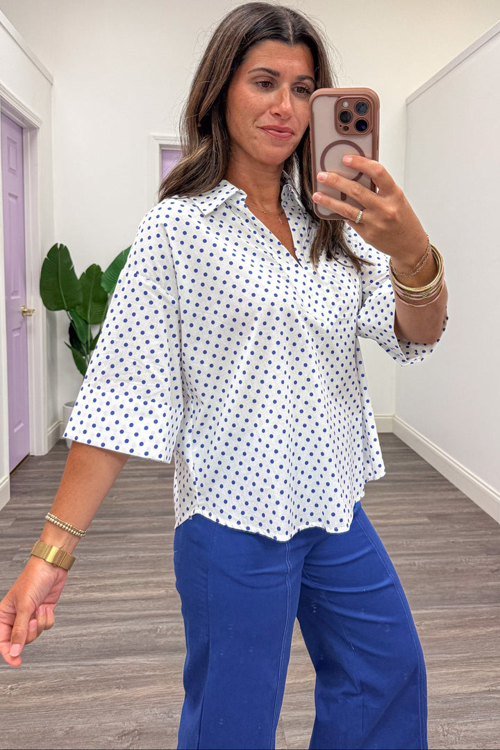 off white with small blue polka dot print collared v neckline drop shoulder half sleeve cotton top