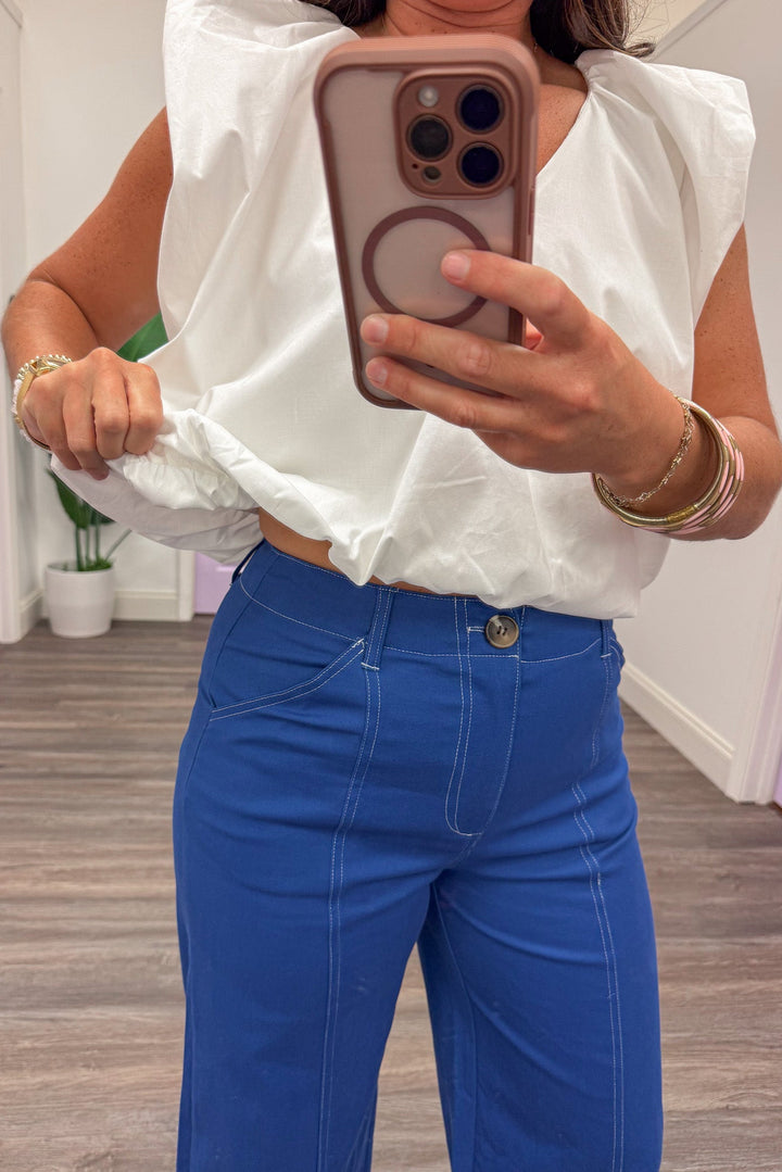 solid white v neckline flutter sleeve bubble bottom hem top