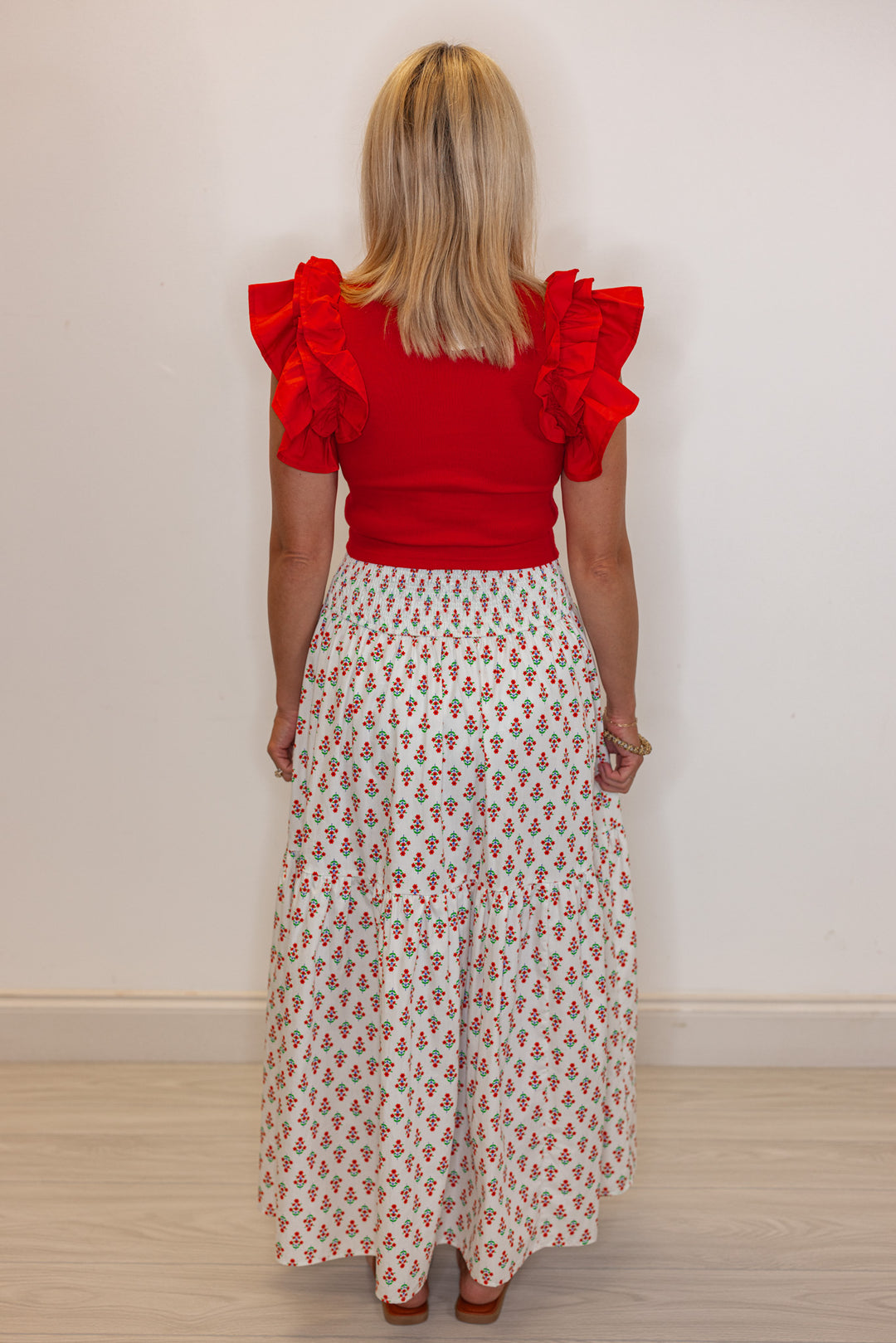 Women's smocked ivory and red floral print tiered poplin maxi skirt by Karlie showing full back view