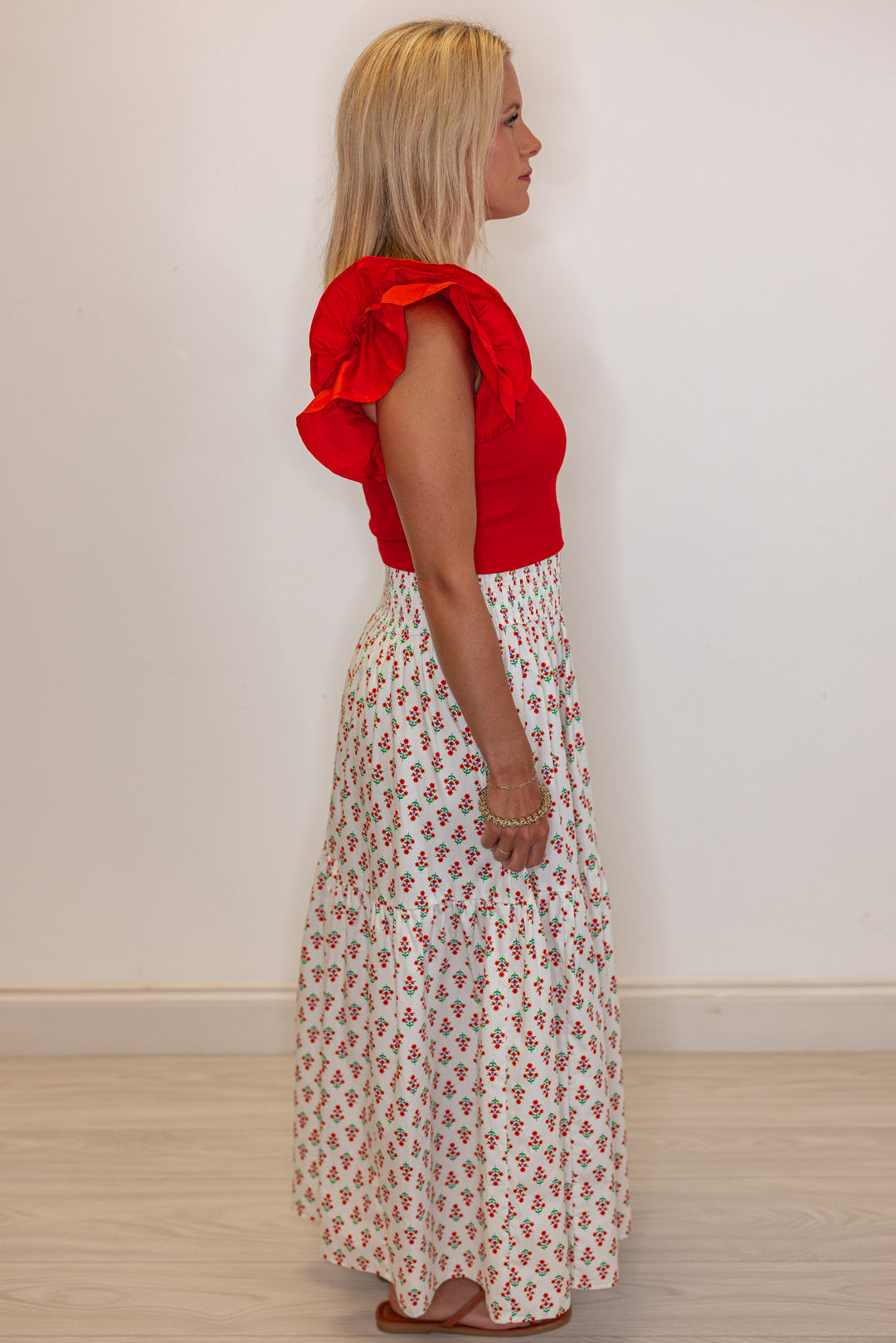 Women's smocked ivory and red floral print tiered poplin maxi skirt by Karlie showing full side view
