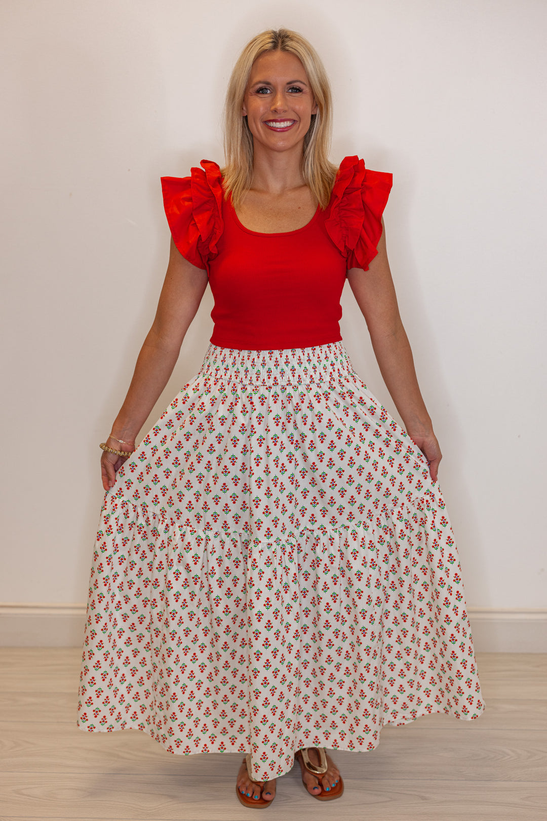 Women's smocked ivory and red floral print tiered poplin maxi skirt by Karlie showing full front view