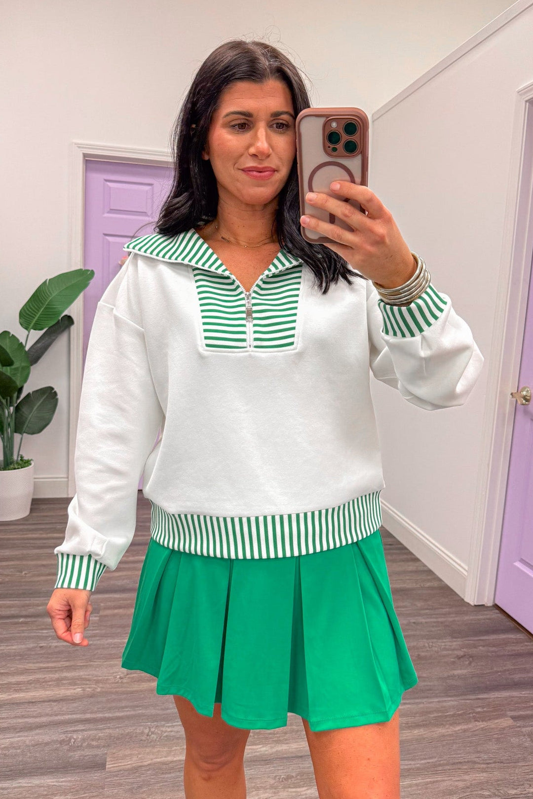 white and green striped athleisure pullover top