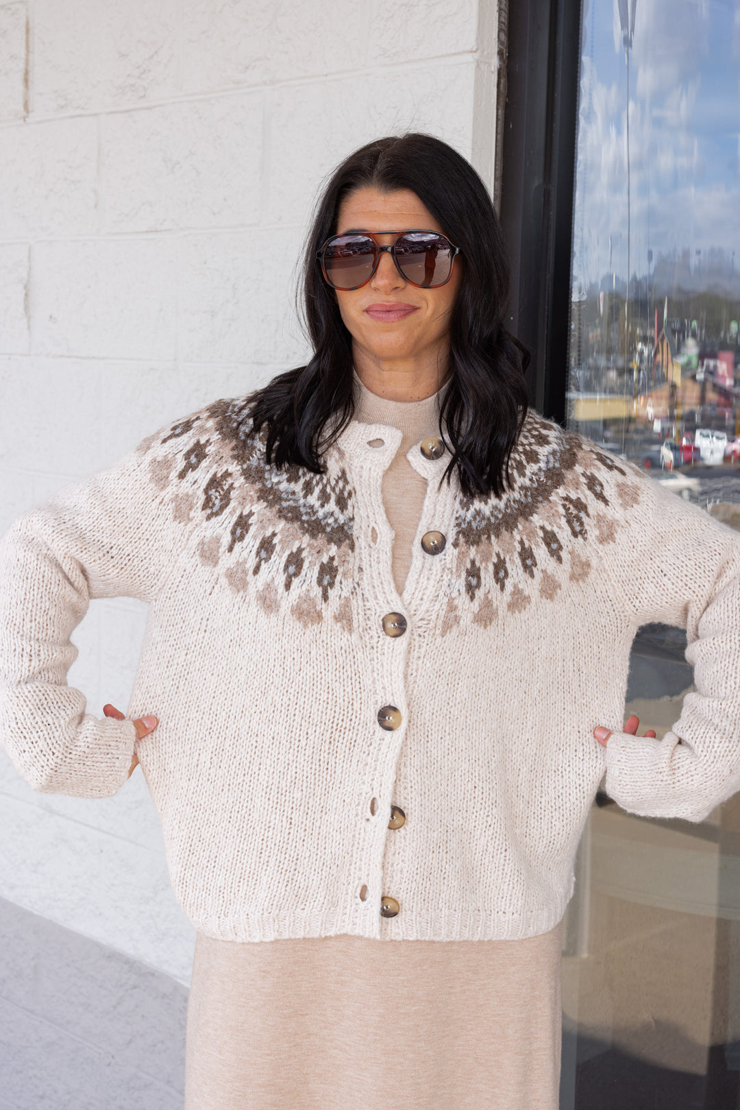 Women's Ivory button front sweater cardigan with print around the shoulders by Blu Pepper showing true to size fit