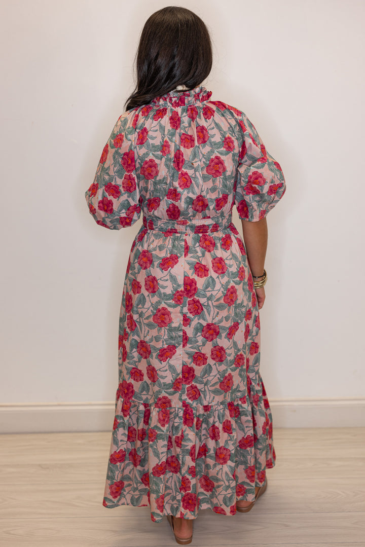Women's pink and green floral maxi dress with puff sleeves and ruffle detail by Entro showing full back view