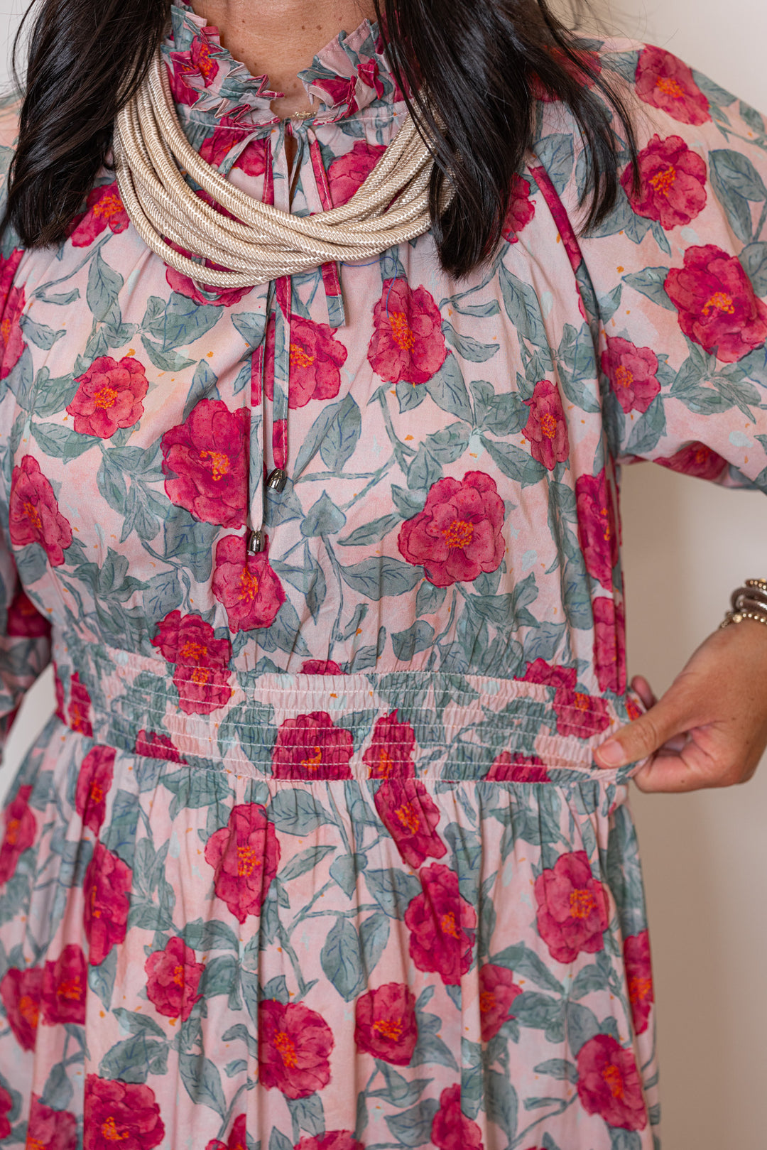 Women's pink and green floral maxi dress with puff sleeves and ruffle detail by Entro showing smocked waistband