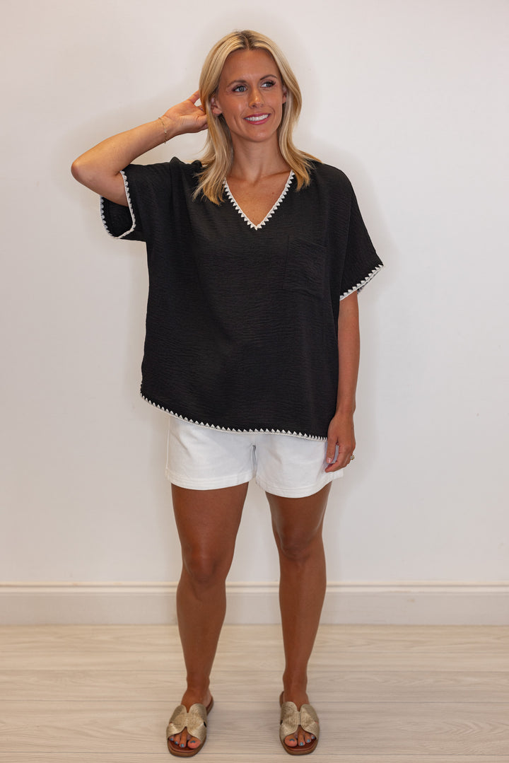 Black lightweight crinkle top with embroidery stitching trim by Jodifl showing full front view