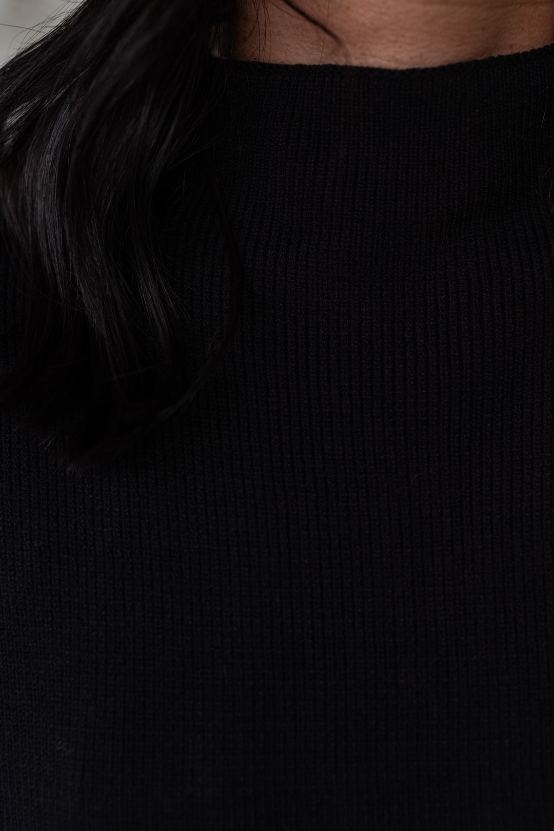 Women's black ribbed knit short dolman sleeve mock neck top by Jodifl showing ribbed knit texture