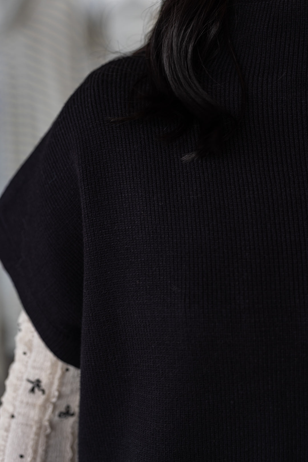 Women's black ribbed knit short dolman sleeve mock neck top by Jodifl showing short dolman sleeves