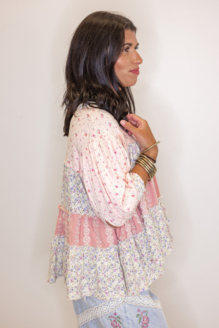 Women's pink and ivory floral patchwork top with embroidery and eyelet details by POL showing up close side view