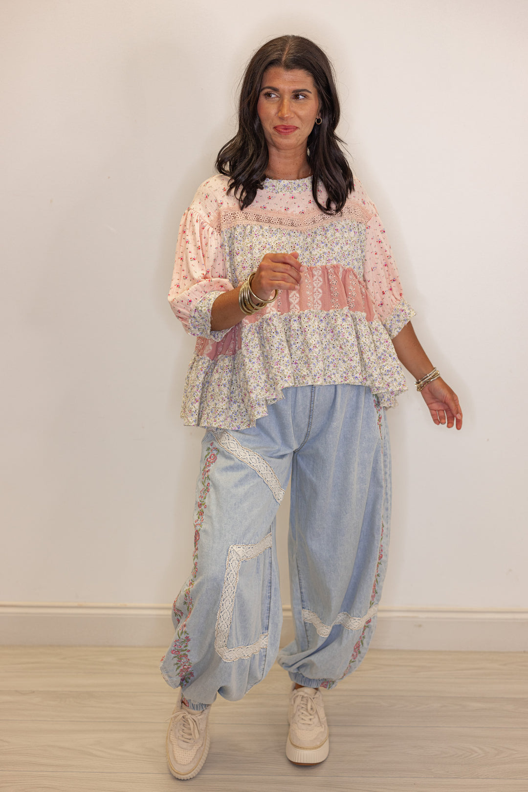 Women's wide leg jogger pants with pink floral embroidery trim and lace details by POL showing wide leg, relaxed fit