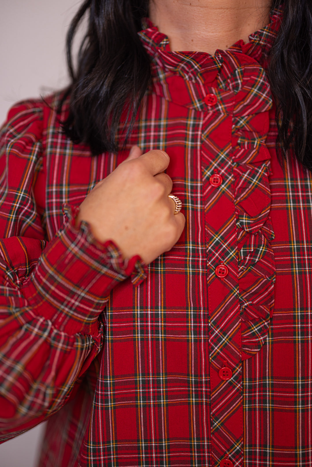 Women's red and green plaid button front top with ruffle details by Entro showing up close bodice view
