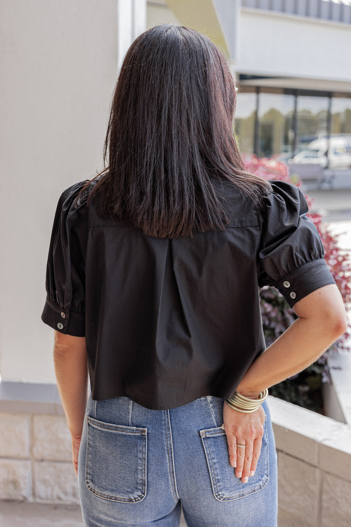 Women's black puff sleeve button front cropped top by Entro showing up close back view