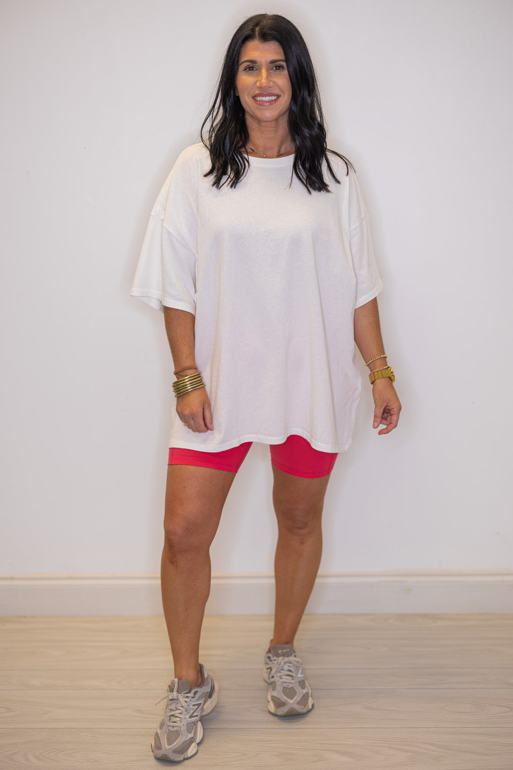 Women's flamingo pink biker shorts with side pockets by Rae Mode