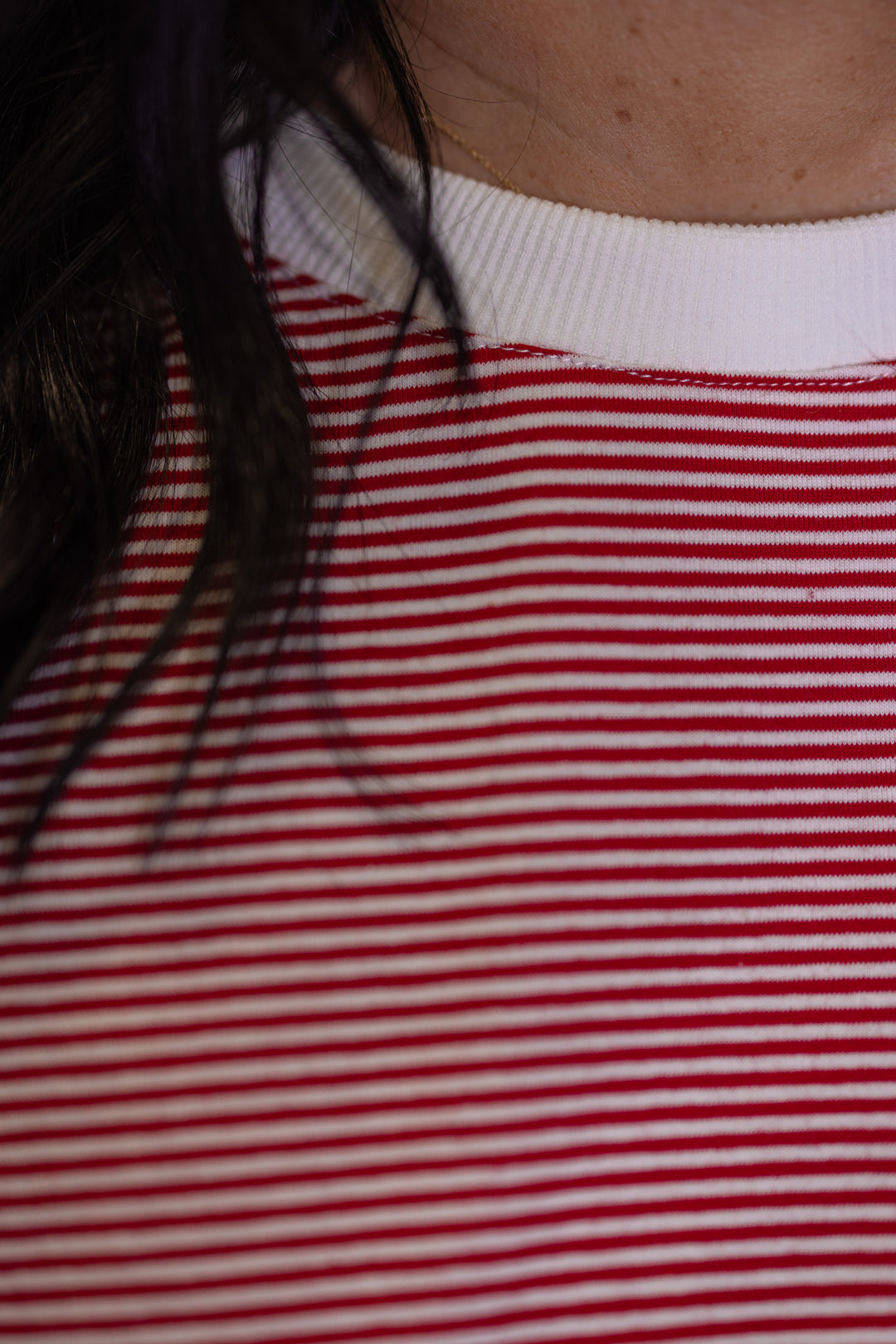 Women's red and white striped knit oversized top with crew neckline
