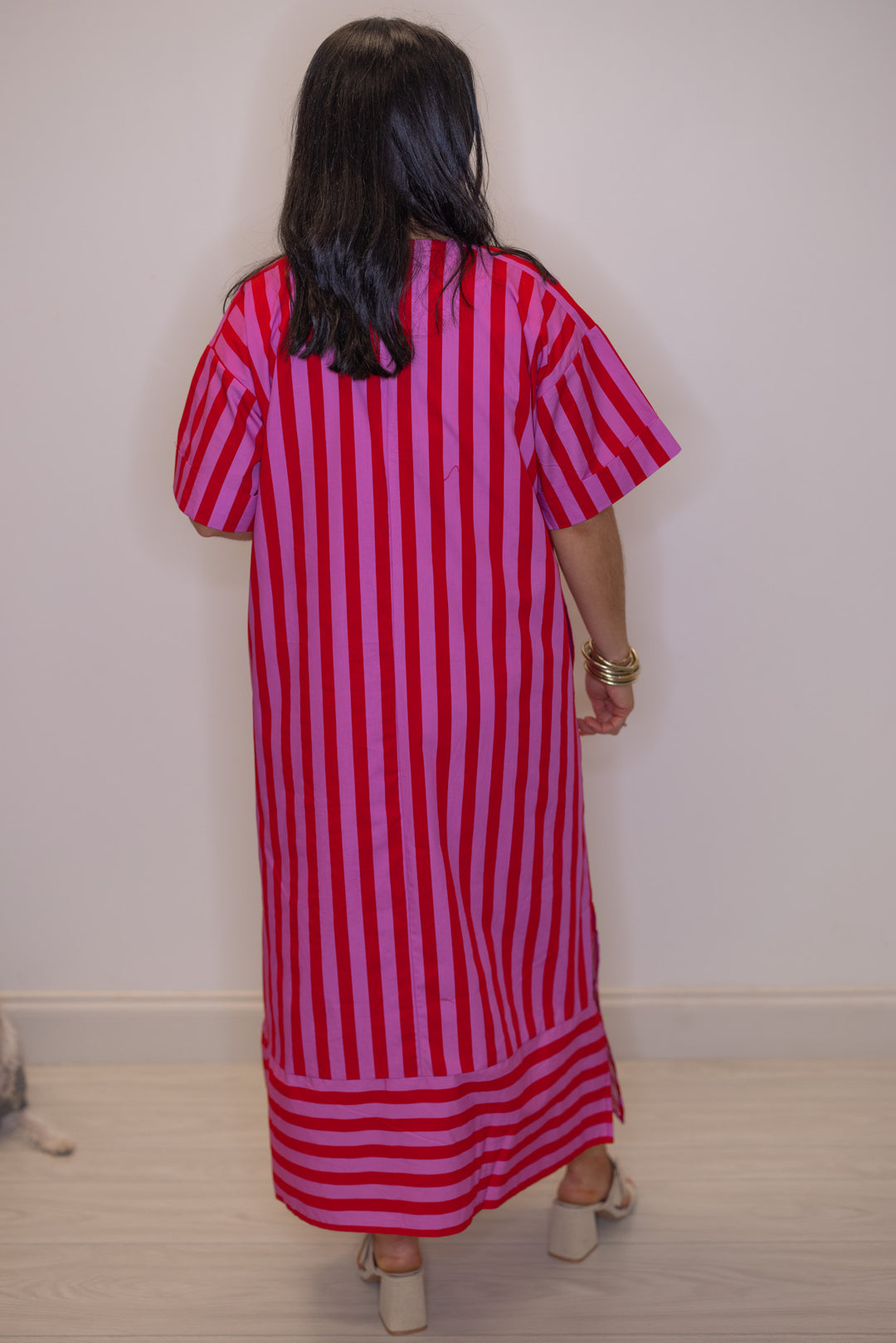 Women's red and pink striped midi dress by Entro showing contrasting bottom hem