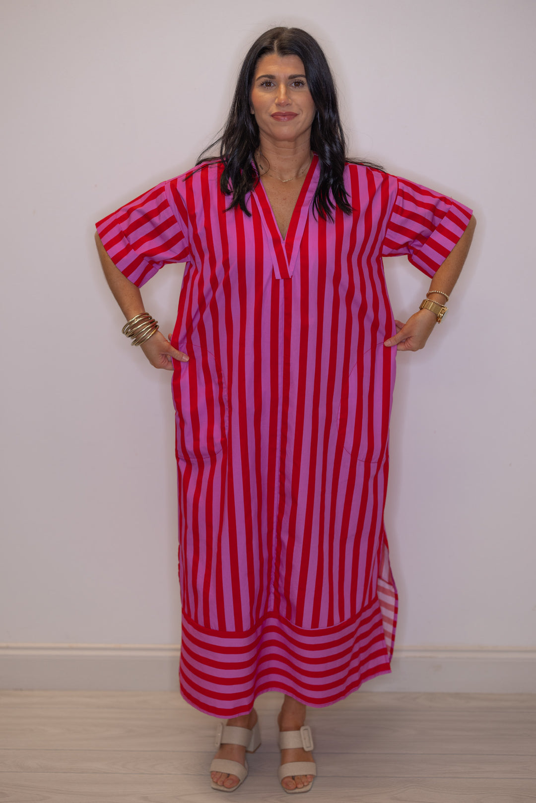 Women's red and pink striped midi dress by Entro showing relaxed silouhette