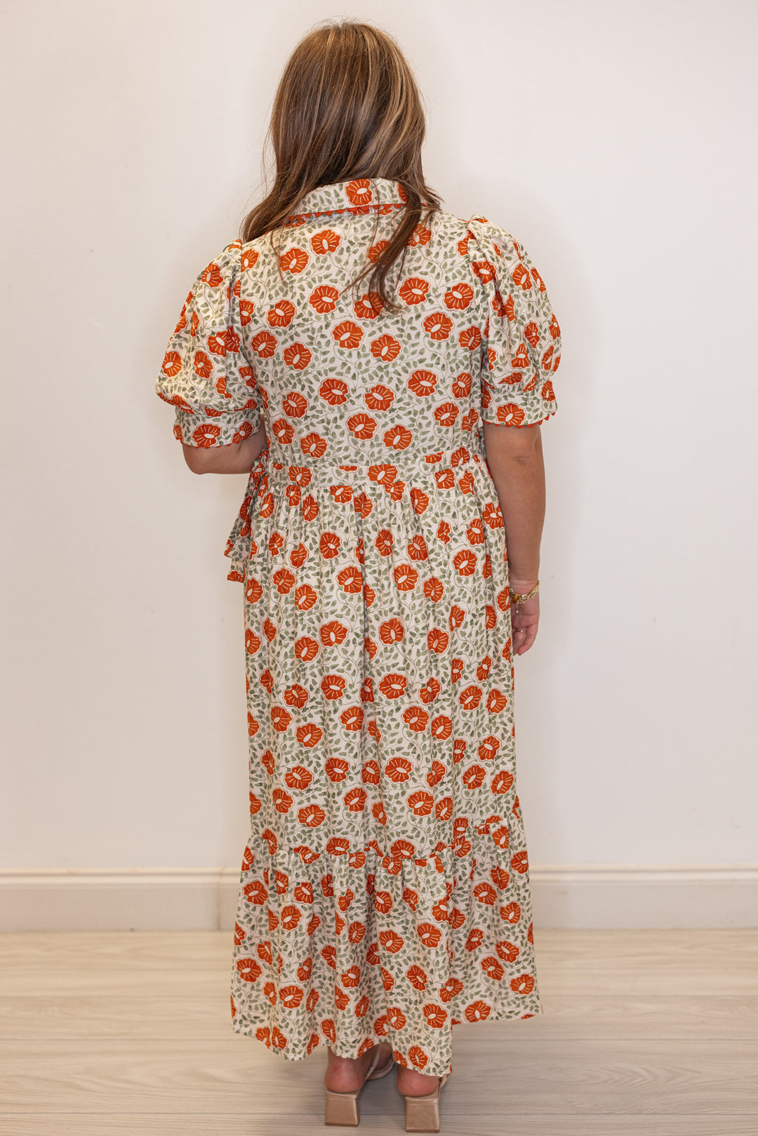 Women's cream button front midi dress with rust floral print by Entro showing full back view