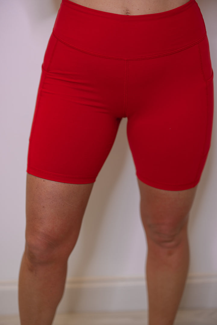 Women's red biker shorts with side pockets by Rae Mode, perfect for pickleball