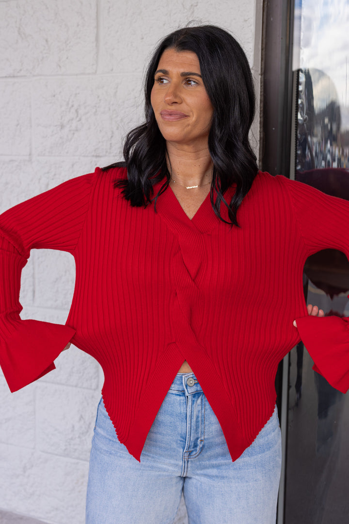 Women's red ribbed sweater knit top with a twisted front and peekaboo shoulders by So Me showing true to size fit