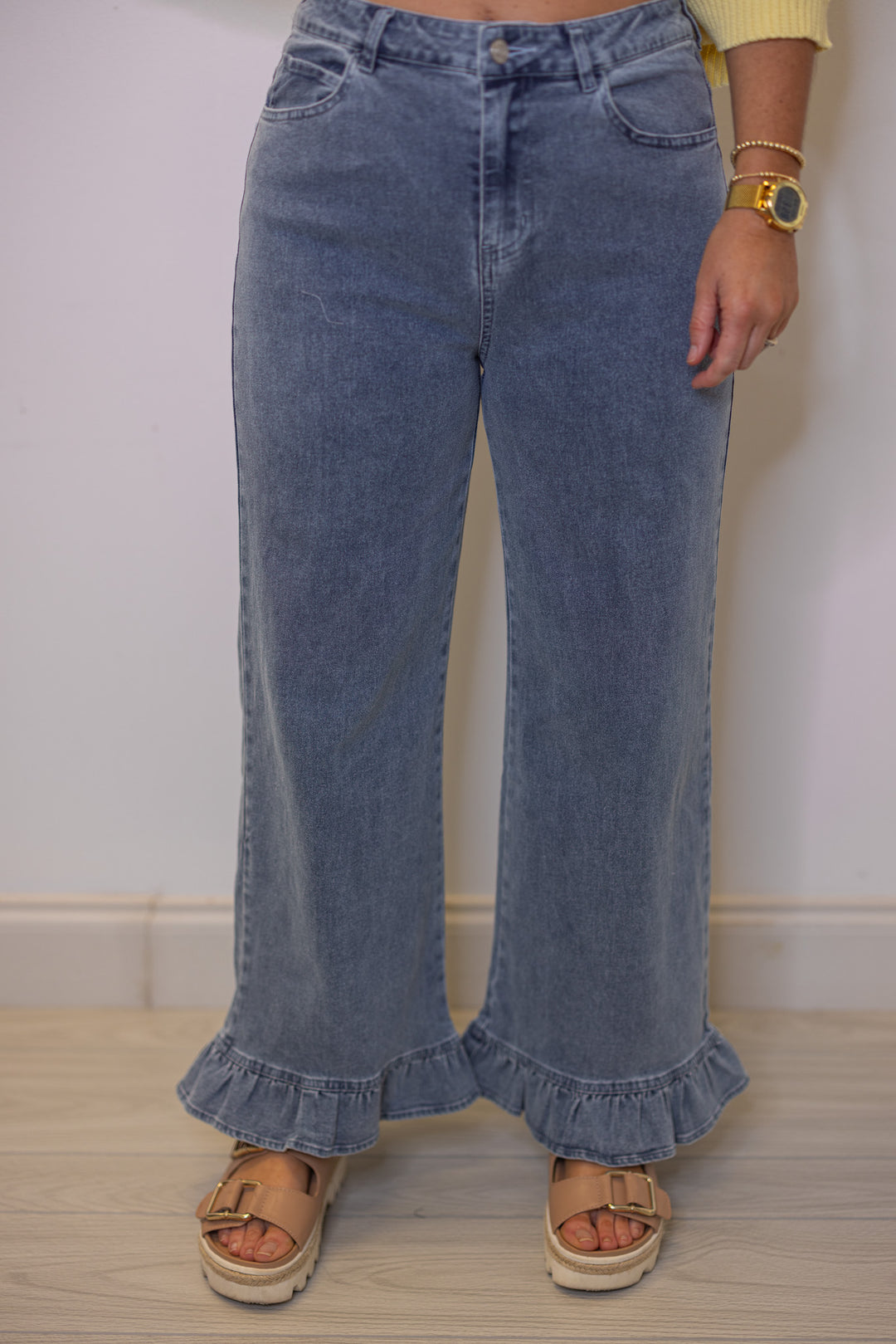 Women's light blue twill denim wide leg pants with ruffle cuffs by Entro, perfect for Spring outfits