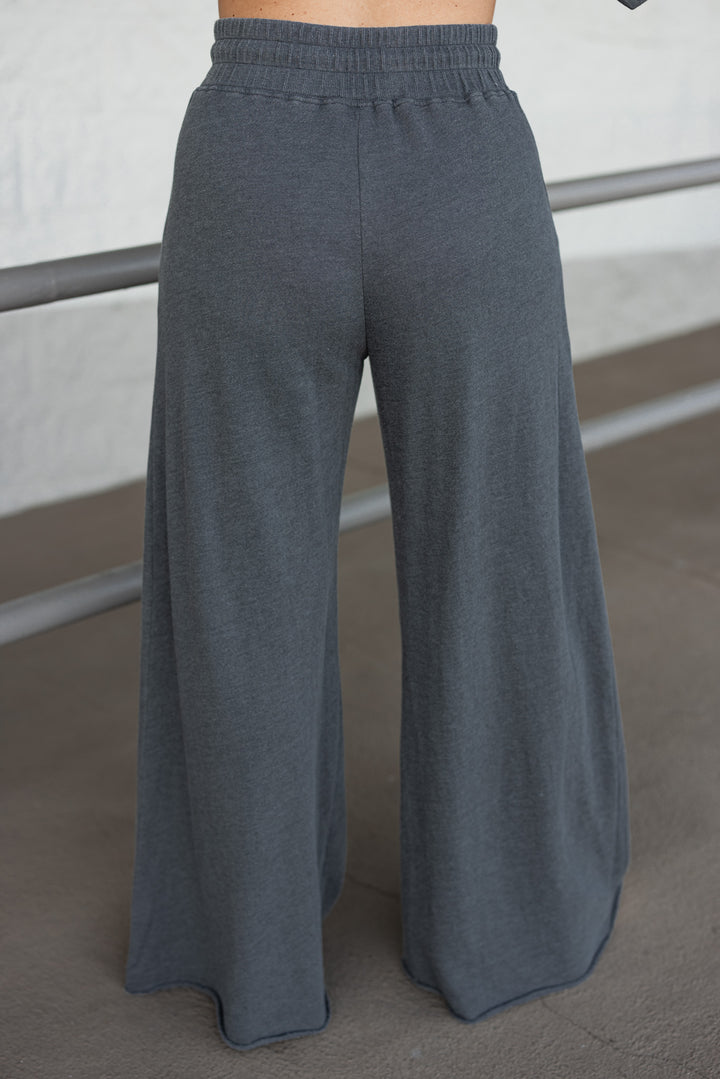 washed black cotton knit wide leg sweatpants back view