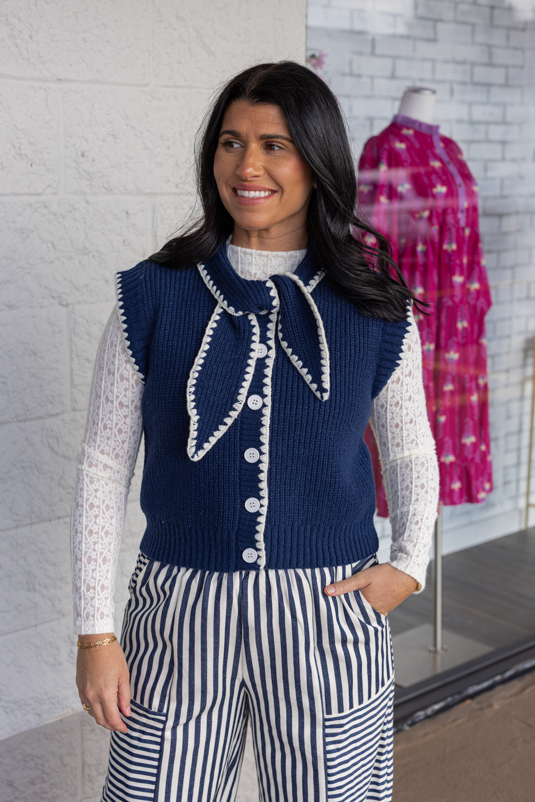 Women's navy blue knit tie neck button front sweater vest with white trim by &merci