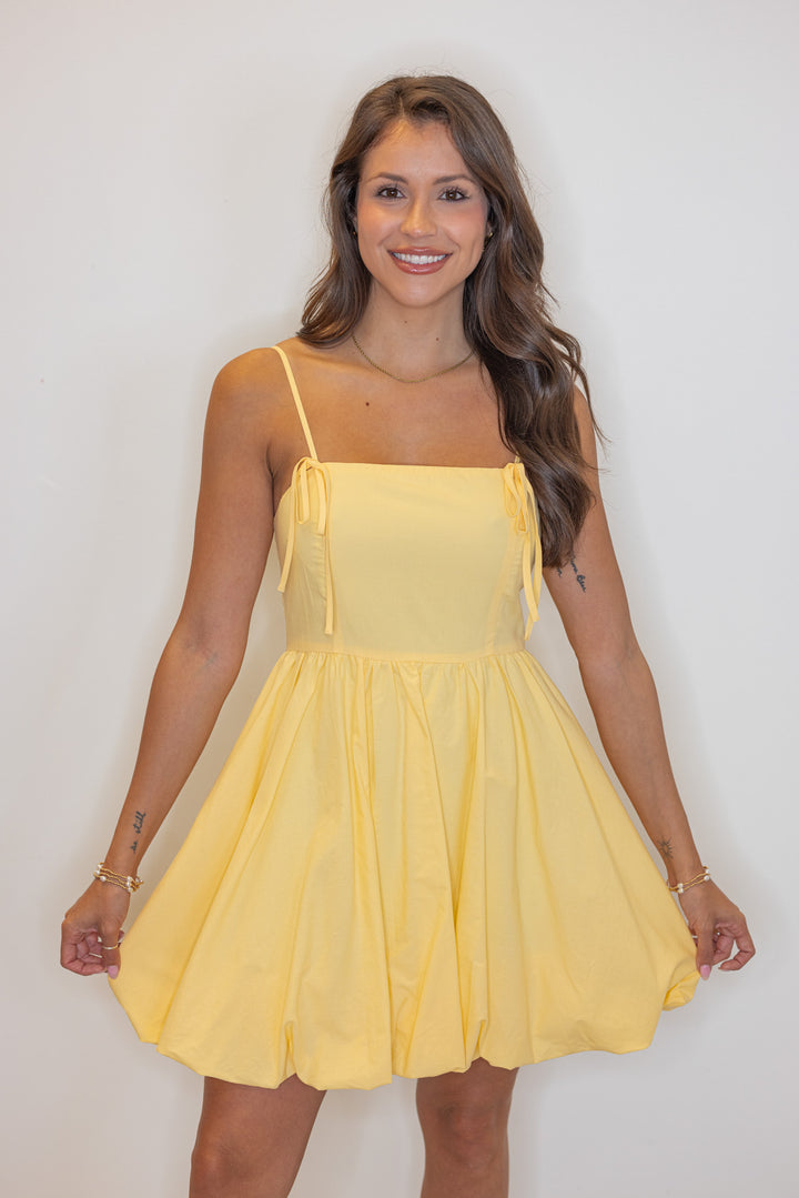 yellow bubble hem mini dress