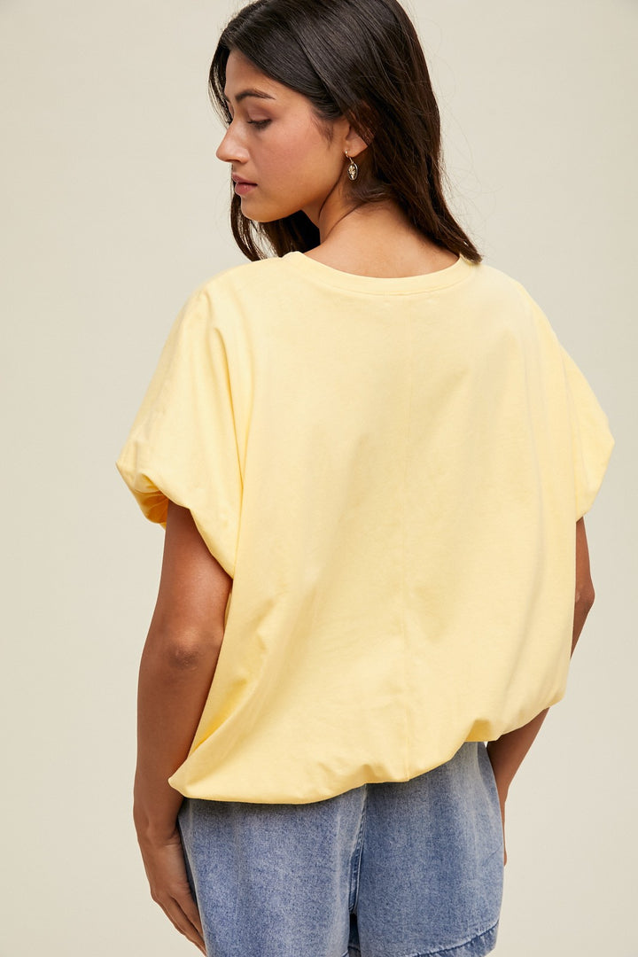 Lemon yellow knit semi-cropped top with bubble hem by Wishlist showing up close back view