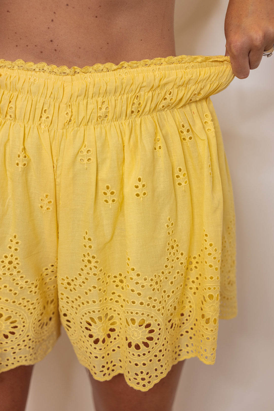 yellow cotton eyelet smocked waist shorts